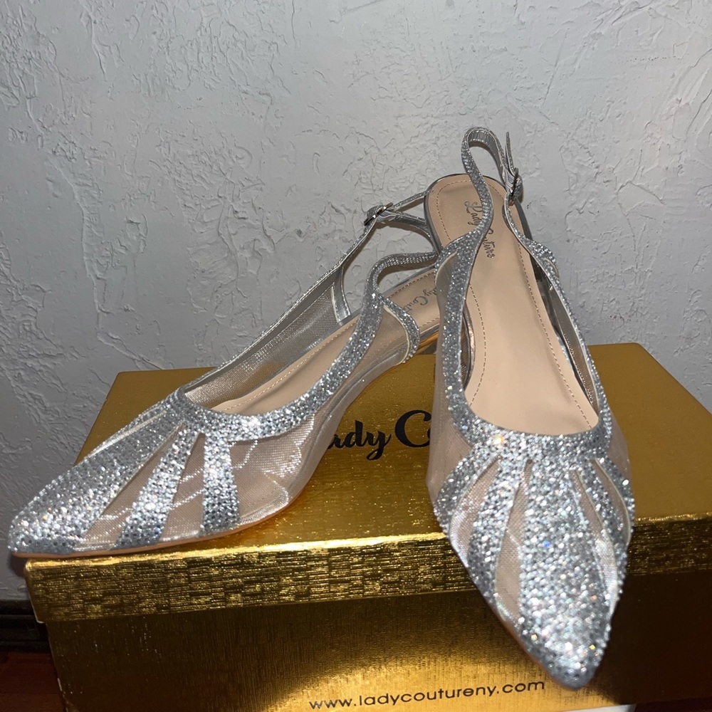 Silver small heel. Never worn